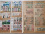 a book with stamps on the pages and a picture of a man
