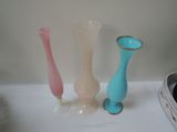 three vases that are sitting on a table