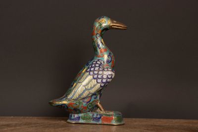 an image of a colorful bird figurine on a table