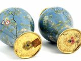 two blue vases that are sitting next to each other