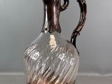 a glass vase that is sitting on a table