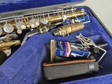 a saxophone in a blue case with keys in it