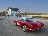 a red and white sports car parked on a dirt road