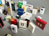 many different types of perfumes on the table