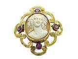 an image of a picture of a woman in a gold broochle
