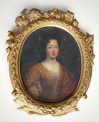 portrait of a woman in a gold dress in a gilded frame