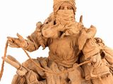 statue of a man on a horse with a spear and a hat