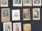 an image of a collection of old religious cards on a table