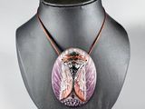 a close up of a necklace on a mannequin on a mannequin