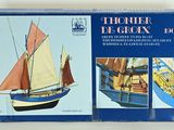 a box with a model of a boat in it