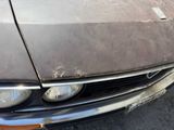 a close up of a car that has a dent in it