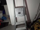a ladder that is leaning against a wall in a room
