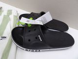 a pair of sandals and a t - shirt sitting on a table