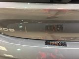a close up of a car ' s bumper with a sticker on it