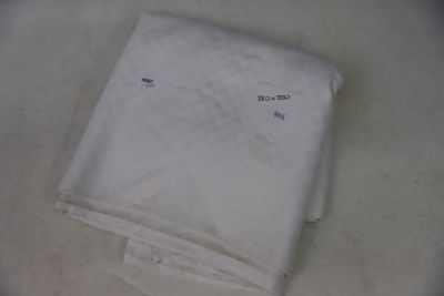a white towel on a table with a white towel on it