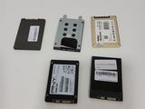 several hard drives are sitting on a table next to each other
