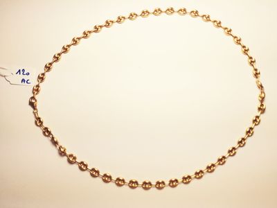 a close up of a gold chain with a tag on it