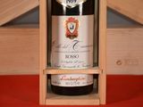 a bottle of wine in a wooden box on a table