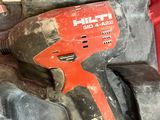 an image of a cordless drill is sitting in a red box