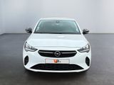 the front view of a white opel parked in a white room