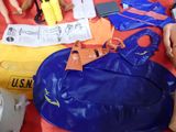 a blue bag sitting on a table with other items on it