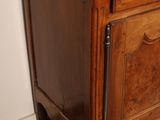 a small wooden cabinet with a drawer on top of it