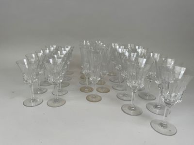 many wine glasses sitting on a table with a coin