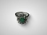 Gros plan sur une bague contenant une pierre verte