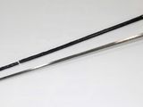 two swords with a handle on a white surface next to a pair of scissors