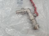 a silver and red faucet in a plastic bag on a table