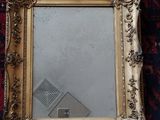 a picture of a mirror that is on the floor