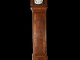 a grandfather clock that is standing in the dark
