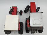 a red tractor and a white truck on a white surface