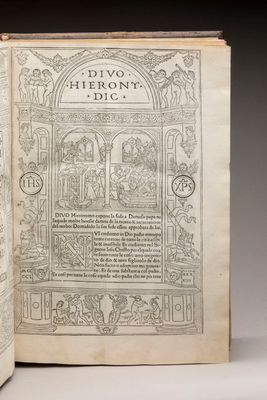 an open book with a picture of a man and woman in a garden