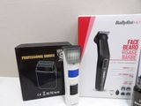 a box with a hair clipper and a hair dryer in it