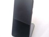 a cell phone that is sitting on top of a stand