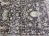 an image of a large oriental rug on a wooden floor