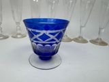 a blue glass with a diamond design on it