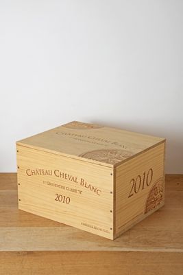 a wooden box that has a wine bottle inside of it