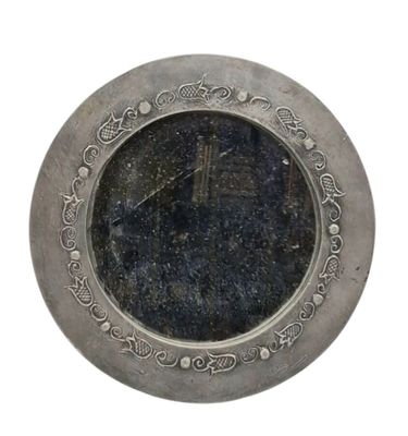 a silver plate with a clock on it on a white background