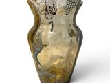 a glass vase with a bird design on it