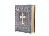 l'image d'un livre sur la couverture duquel figure une croix