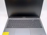 an open laptop computer sitting on top of a white table
