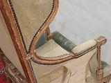 a chair that is sitting on a rug on the floor