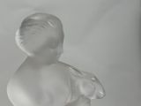 an image of a glass figurine of a baby