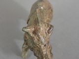a small statue of a horse that is standing on a table