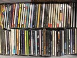 a box full of various cd ' s on the floor