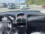 a car that is driving down the street with other cars in the background