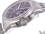 a close up of a watch on a metal bracelet