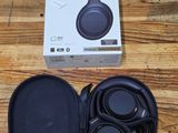 a box of headphones sitting on a wooden table